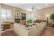 Comfortable living room with fireplace, large sectional sofa, and natural light at 7816 Sandy Eagle Ct, Las Vegas, NV 89129