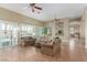Inviting living space featuring plantation shutters, comfortable seating, and tile flooring at 7816 Sandy Eagle Ct, Las Vegas, NV 89129
