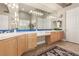 Bathroom featuring dual sinks, vanity area, neutral paint and tile floors at 7816 Sandy Eagle Ct, Las Vegas, NV 89129