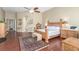 Spacious bedroom with decorative wood bed frame, decorative rug, and wood floors at 7816 Sandy Eagle Ct, Las Vegas, NV 89129