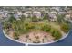 Aerial view of a community park with mature trees, winding paths, and beautifully landscaped areas at 7816 Sandy Eagle Ct, Las Vegas, NV 89129