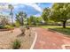 Beautiful community park with walking trail, lush landscaping, and decorative features at 7816 Sandy Eagle Ct, Las Vegas, NV 89129