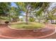 Community park with walking trails, lush greenery, and mature trees at 7816 Sandy Eagle Ct, Las Vegas, NV 89129
