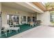 This covered patio includes outdoor furniture, ceiling fans, and a grill at 7816 Sandy Eagle Ct, Las Vegas, NV 89129