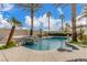 The backyard has a pool, spa, waterfall feature, and mature landscaping at 7816 Sandy Eagle Ct, Las Vegas, NV 89129