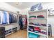 Spacious walk-in closet with built-in shelving and ample storage space at 7816 Sandy Eagle Ct, Las Vegas, NV 89129