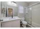 Updated bathroom featuring white vanity, modern fixtures and walk-in shower at 7836 Pinnochio Ave, Las Vegas, NV 89131