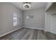 Bright bedroom with wood-look floors and ample natural light from the large window at 7836 Pinnochio Ave, Las Vegas, NV 89131
