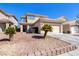 Charming home featuring a desert landscape, an attached three-car garage, and a welcoming front porch at 7836 Pinnochio Ave, Las Vegas, NV 89131