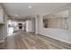 Open-concept living and dining area featuring modern flooring and natural light at 7836 Pinnochio Ave, Las Vegas, NV 89131