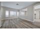 Open-concept living room featuring bright windows and modern flooring at 7836 Pinnochio Ave, Las Vegas, NV 89131