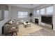 Inviting living room with a cozy fireplace, plush seating, and bright natural light at 7836 Pinnochio Ave, Las Vegas, NV 89131