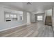 Open-concept living room with plenty of natural light and modern flooring at 7836 Pinnochio Ave, Las Vegas, NV 89131