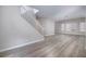 Inviting living room features modern flooring, staircase, and bright windows at 7836 Pinnochio Ave, Las Vegas, NV 89131