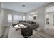 Spacious living room with large windows, comfortable seating, and stylish decor at 7836 Pinnochio Ave, Las Vegas, NV 89131