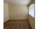 Comfortable bedroom featuring neutral walls, carpet flooring, and a large window letting in natural light at 8009 Draco Cir # 201, Las Vegas, NV 89128