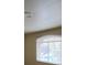 Cozy bedroom with a large window letting in natural light with neutral-toned walls and flooring at 8009 Draco Cir # 201, Las Vegas, NV 89128