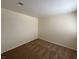 Simple bedroom featuring neutral walls, carpet flooring, a large window and ample space at 8009 Draco Cir # 201, Las Vegas, NV 89128