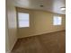 Spacious bedroom features carpet, natural light and neutral colored walls at 8009 Draco Cir # 201, Las Vegas, NV 89128