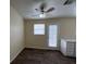 Bright dining area featuring wood-look floors, a ceiling fan, and a view of the backyard at 8009 Draco Cir # 201, Las Vegas, NV 89128