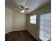 Dining area with wood-look floors, ceiling fan, a window and door to the exterior, and neutral paint at 8009 Draco Cir # 201, Las Vegas, NV 89128