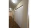 Spacious hallway closet features bi-fold doors and neutral walls at 8009 Draco Cir # 201, Las Vegas, NV 89128