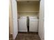 Convenient laundry closet includes a washer, dryer, and shelving at 8009 Draco Cir # 201, Las Vegas, NV 89128