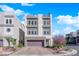 Modern three-story home showcasing clean lines, neutral color palette, and an inviting two-car garage at 8178 Eaton Hill St, Las Vegas, NV 89113