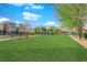 Enjoy community green spaces and parks with lush grass and mature trees at 8178 Eaton Hill St, Las Vegas, NV 89113