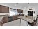 Bright kitchen with stainless appliances, granite countertops, and dark wood cabinets at 8178 Eaton Hill St, Las Vegas, NV 89113