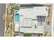 Stunning aerial view of the property featuring a pool, lush landscaping, and modern architecture at 818 Calluna St, Las Vegas, NV 89138