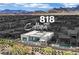 Aerial view of 818 Calluna Street highlighting a modern home, pool, and mountain views at 818 Calluna St, Las Vegas, NV 89138