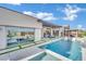 Gorgeous backyard with a pool, spa, and outdoor living area for entertaining guests at 818 Calluna St, Las Vegas, NV 89138