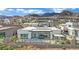 Beautiful backyard with a modern pool, patio, and mountain views in a luxurious community at 818 Calluna St, Las Vegas, NV 89138