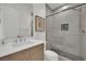 Modern bathroom features a glass shower, a floating vanity, and sleek, minimalist decor at 818 Calluna St, Las Vegas, NV 89138