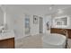 Bathroom featuring a soaking tub and double vanity at 818 Calluna St, Las Vegas, NV 89138