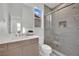 Modern bathroom with a glass shower, floating vanity, and neutral color palette at 818 Calluna St, Las Vegas, NV 89138