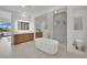 Modern bathroom with a soaking tub, shower, and dual sink vanity at 818 Calluna St, Las Vegas, NV 89138