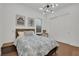 This comfortable bedroom features modern lighting, a work space, and closet for storage at 818 Calluna St, Las Vegas, NV 89138
