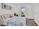 Bright bedroom with a large window, comfortable bed, and minimalist decor at 818 Calluna St, Las Vegas, NV 89138