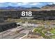 The Sandalwood Community entrance with beautiful landscaping and mountain views at 818 Calluna St, Las Vegas, NV 89138