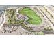 An aerial view of a community park with a pergola, lush green grass, and desert landscaping at 818 Calluna St, Las Vegas, NV 89138