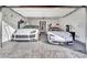 A spacious three-car garage with epoxy floors and multiple electric vehicle chargers at 818 Calluna St, Las Vegas, NV 89138
