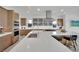 Well-appointed kitchen featuring stainless steel appliances and a large island with seating at 818 Calluna St, Las Vegas, NV 89138