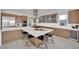 Stylish kitchen with a large island, bar seating, and modern appliances at 818 Calluna St, Las Vegas, NV 89138