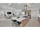 Open concept kitchen with a large island, stainless steel appliances, and access to the living room at 818 Calluna St, Las Vegas, NV 89138