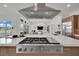 Spacious kitchen island featuring a gas range and open view to the living room at 818 Calluna St, Las Vegas, NV 89138