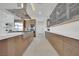 Spacious kitchen with island cooktop, stainless steel hood, white countertop, and long row of cabinets at 818 Calluna St, Las Vegas, NV 89138