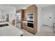 Clean kitchen view featuring stainless steel refrigerator, built-in microwave, oven, and sleek design at 818 Calluna St, Las Vegas, NV 89138