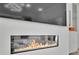 Modern fireplace with flatscreen TV creates cozy ambiance in living space at 818 Calluna St, Las Vegas, NV 89138